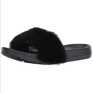 Used black Ugg Royale slide.
